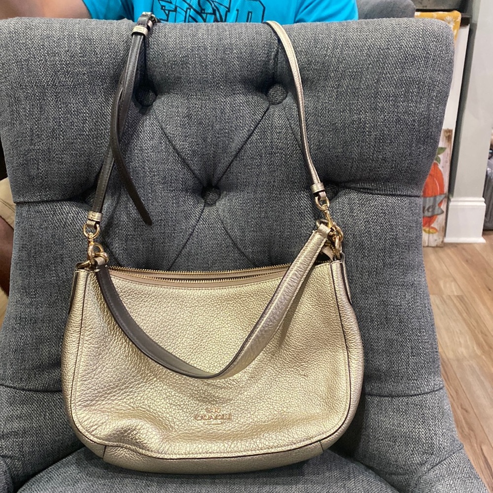 Small gold Coach purse